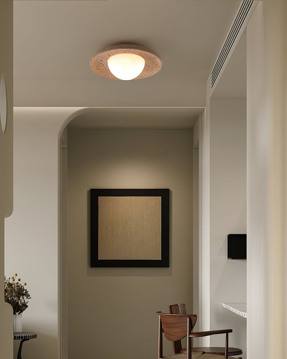 The Jenny Ceiling Light shown in a modern, minimalist room setting.