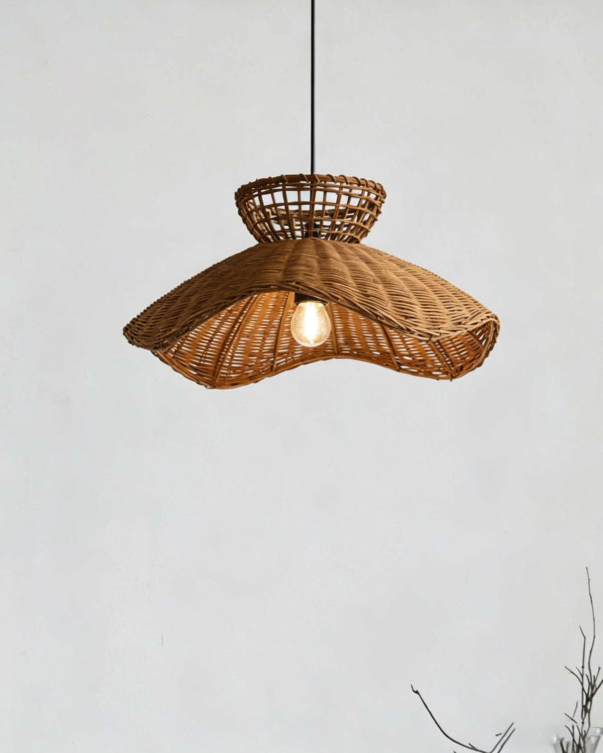 The Jumbo Pendant Light illuminated, casting a warm and diffused light.