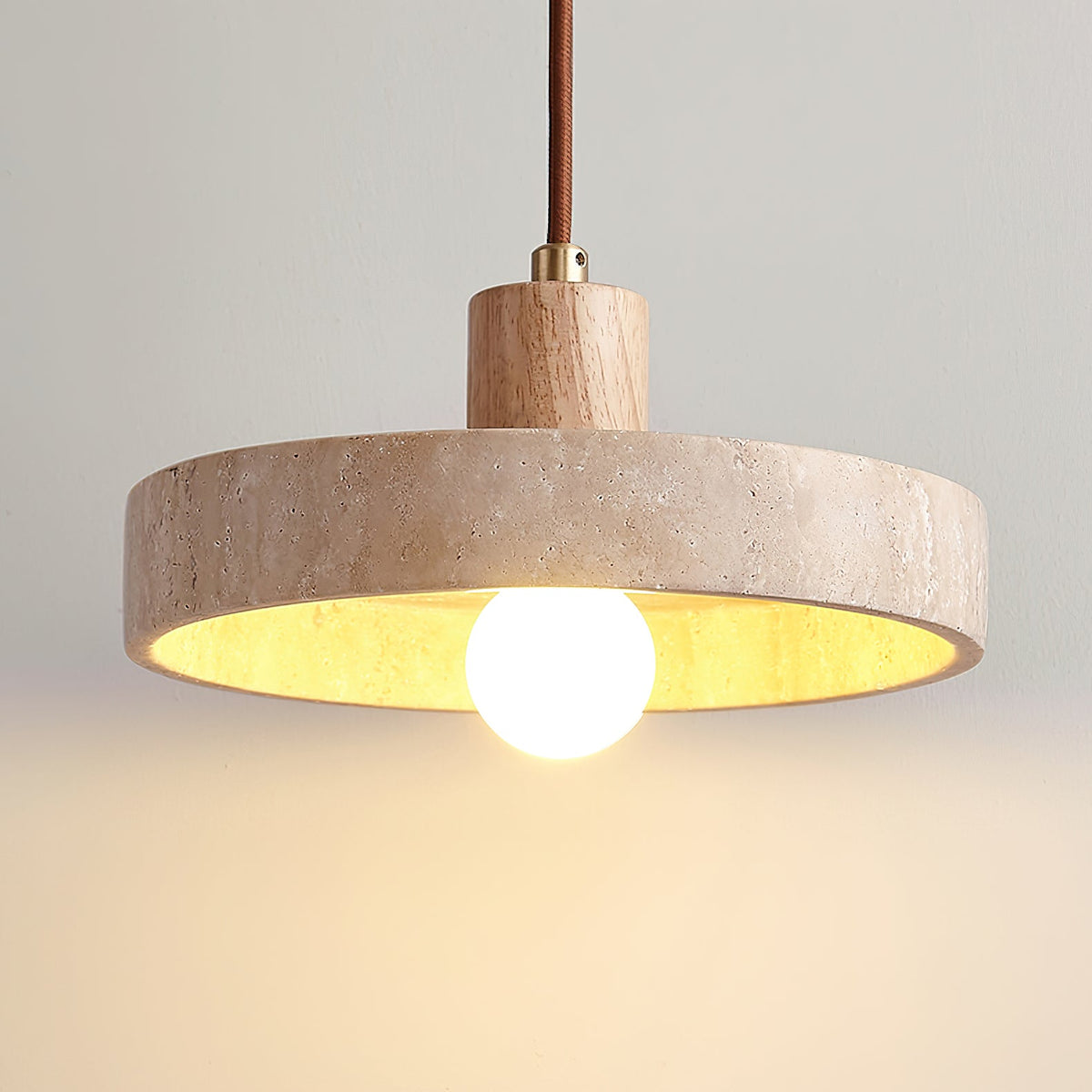 The three-light Kairi Pendant Lamp in a beige and walnut finish.