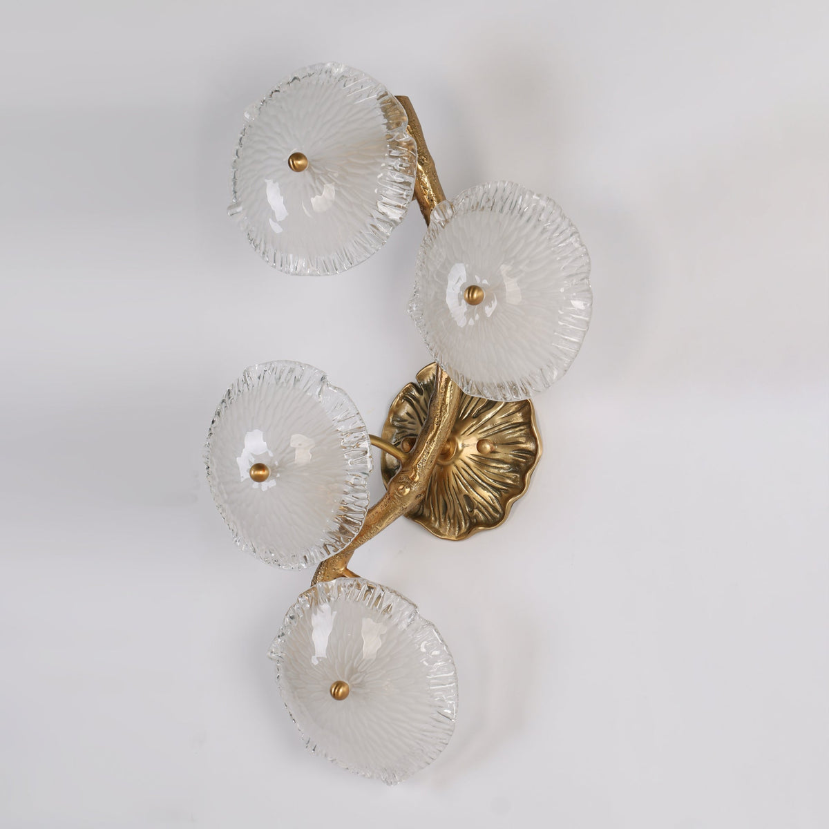 Angled view of the Kamal Wall Lamp showcasing its artistic form.