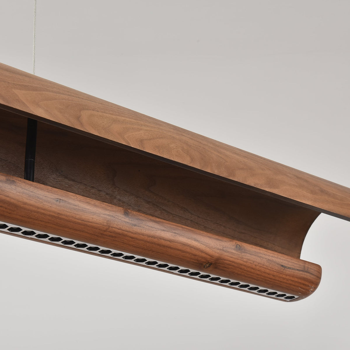 Close-up of the ceiling mount and suspension wires for the Kanoe chandelier.