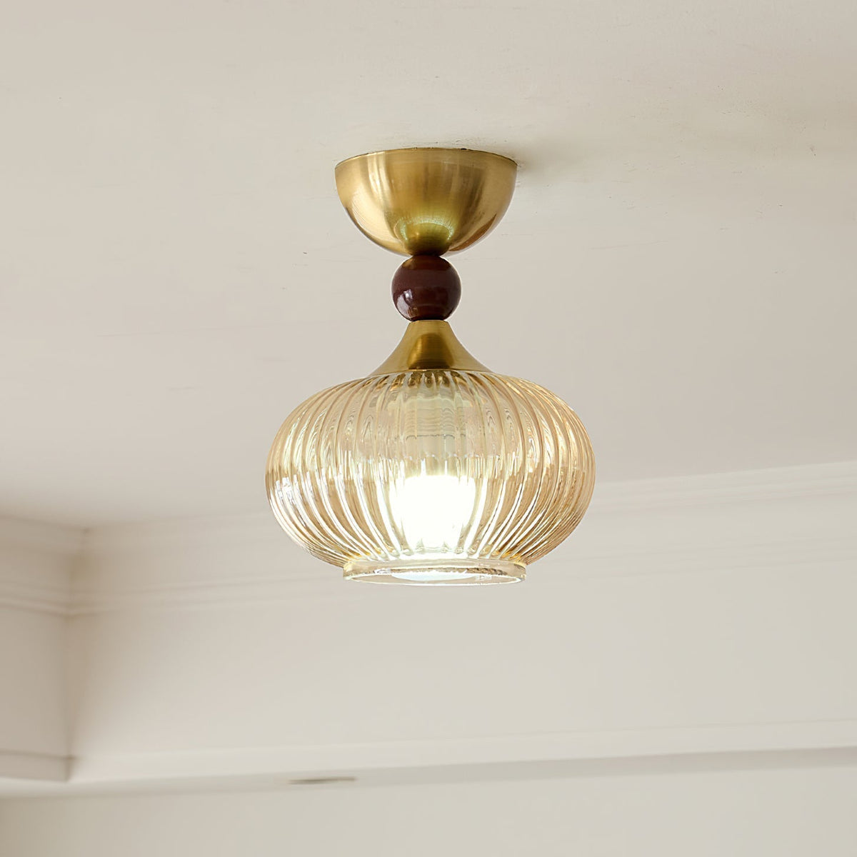 Detail shot of the gold metal canopy and suspension.