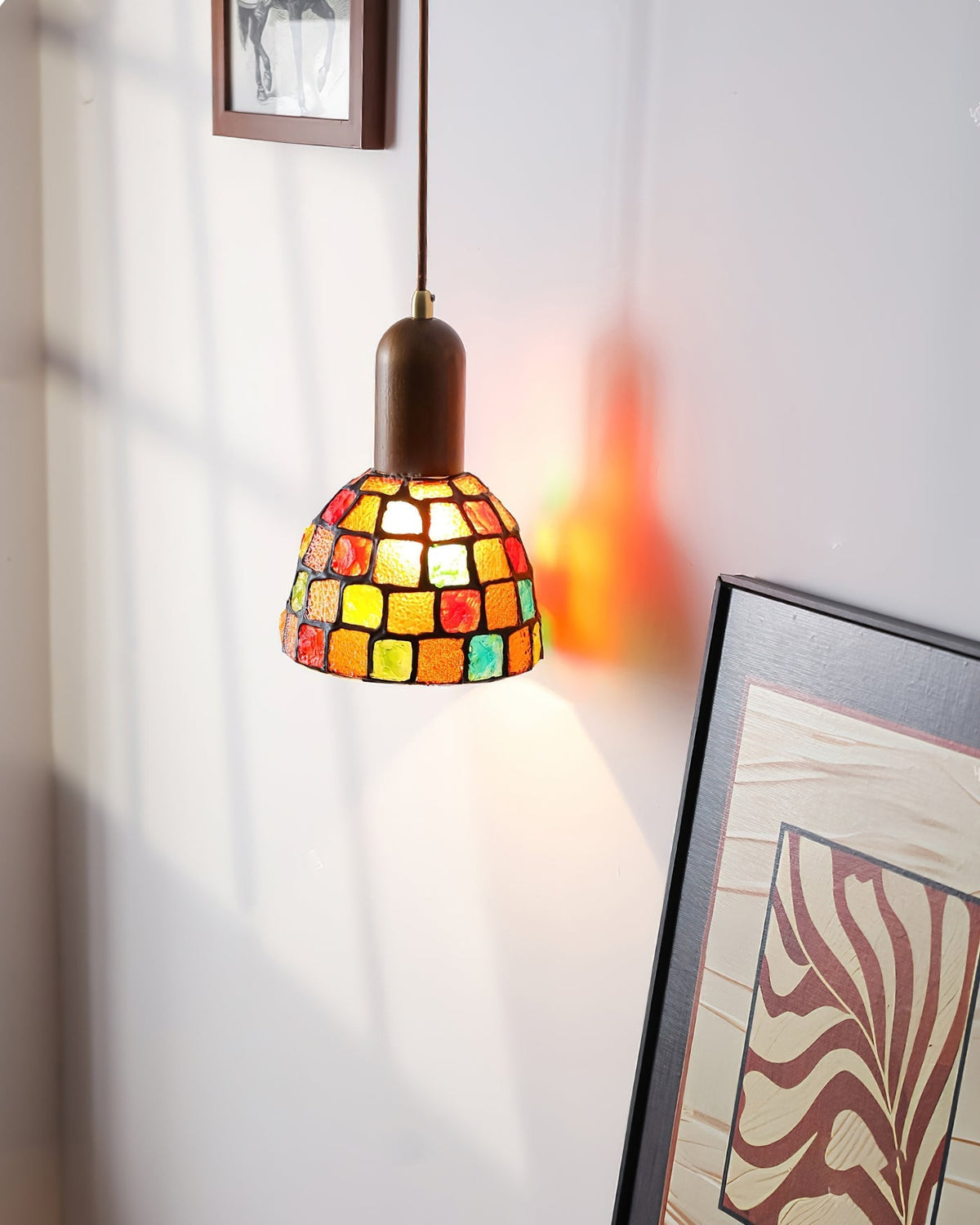 The single Klima Pendant Light used as a bedside lamp.