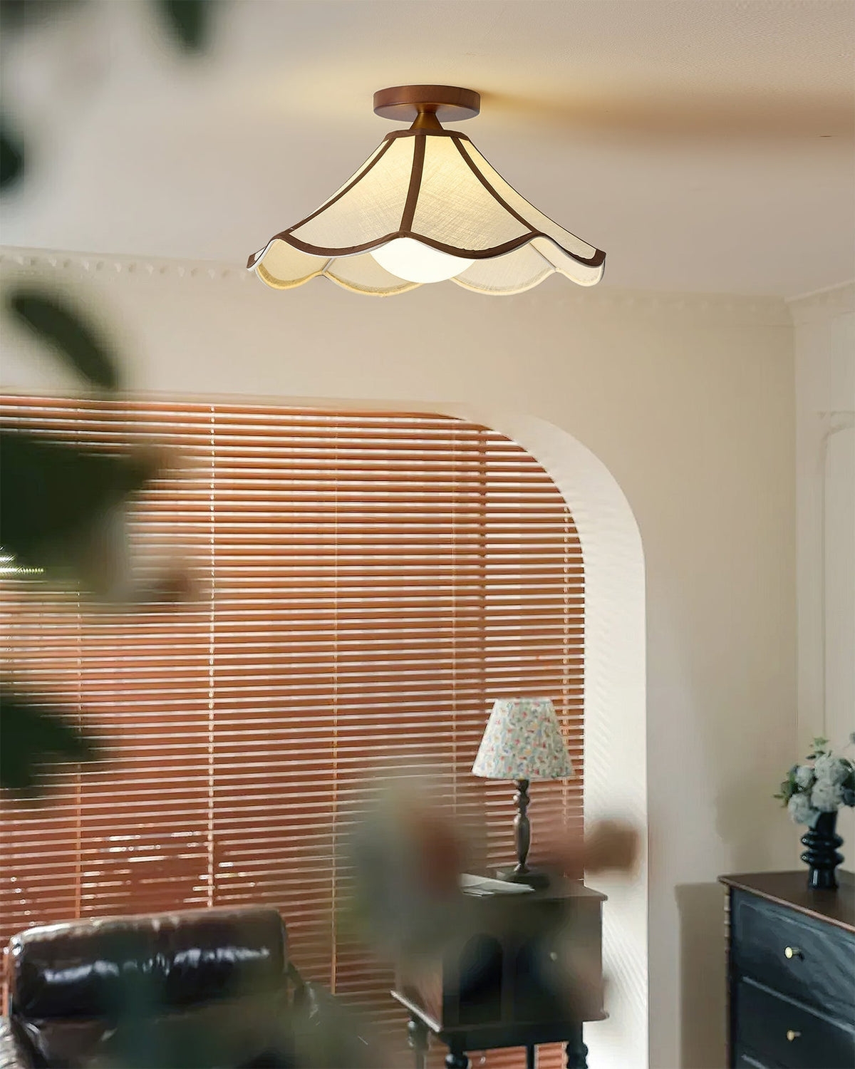 Lonzo Ceiling Light shown illuminated in a cozy living room.