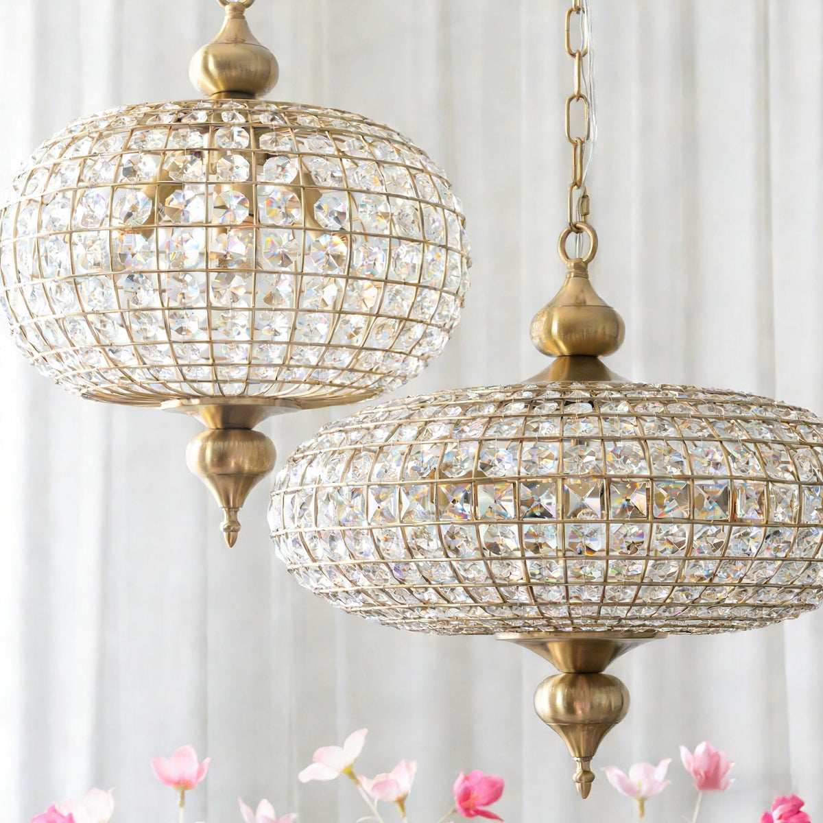 The gold Lucille pendant light against a dark background.