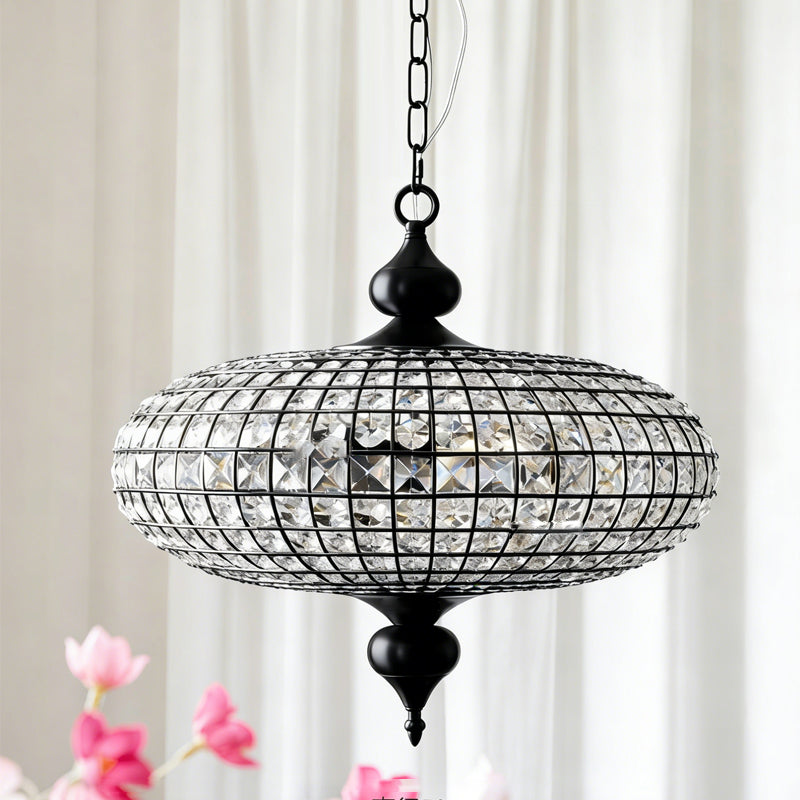 The smaller size Lucille pendant light shown in a hallway.