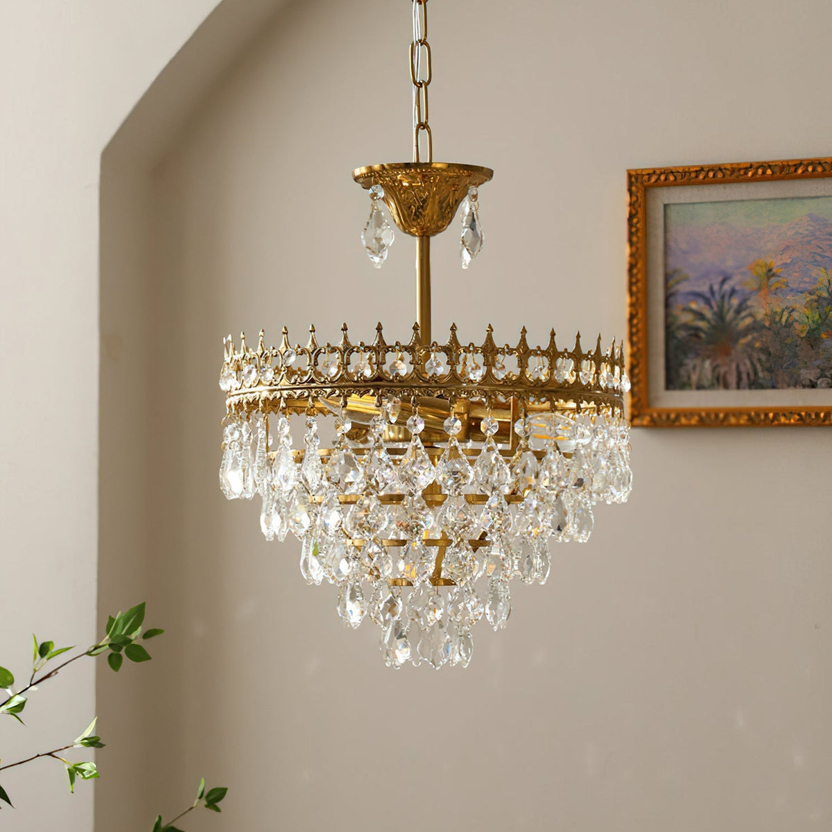 Close-up view of the Marilyn Chandelier's faceted crystals and gold frame.