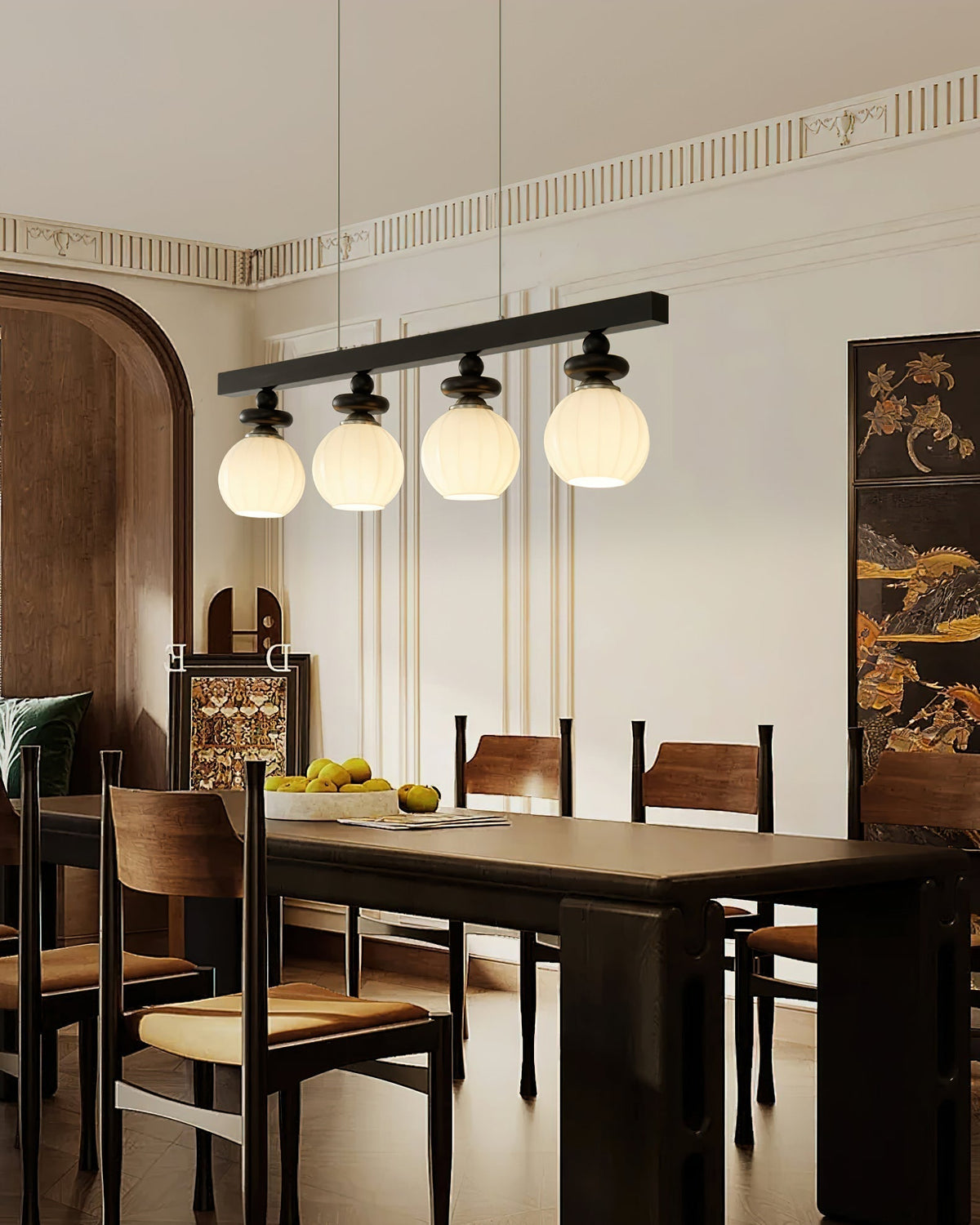 The Maru Pendant Light hanging over a modern dining table.