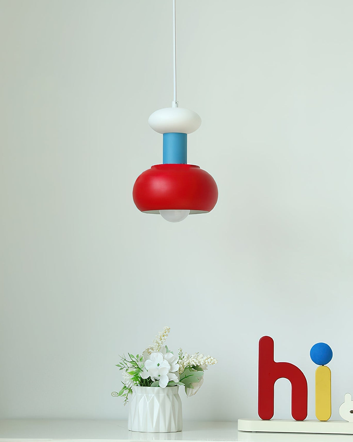 Lifestyle image of the Meli Pendant Light in a dining area.