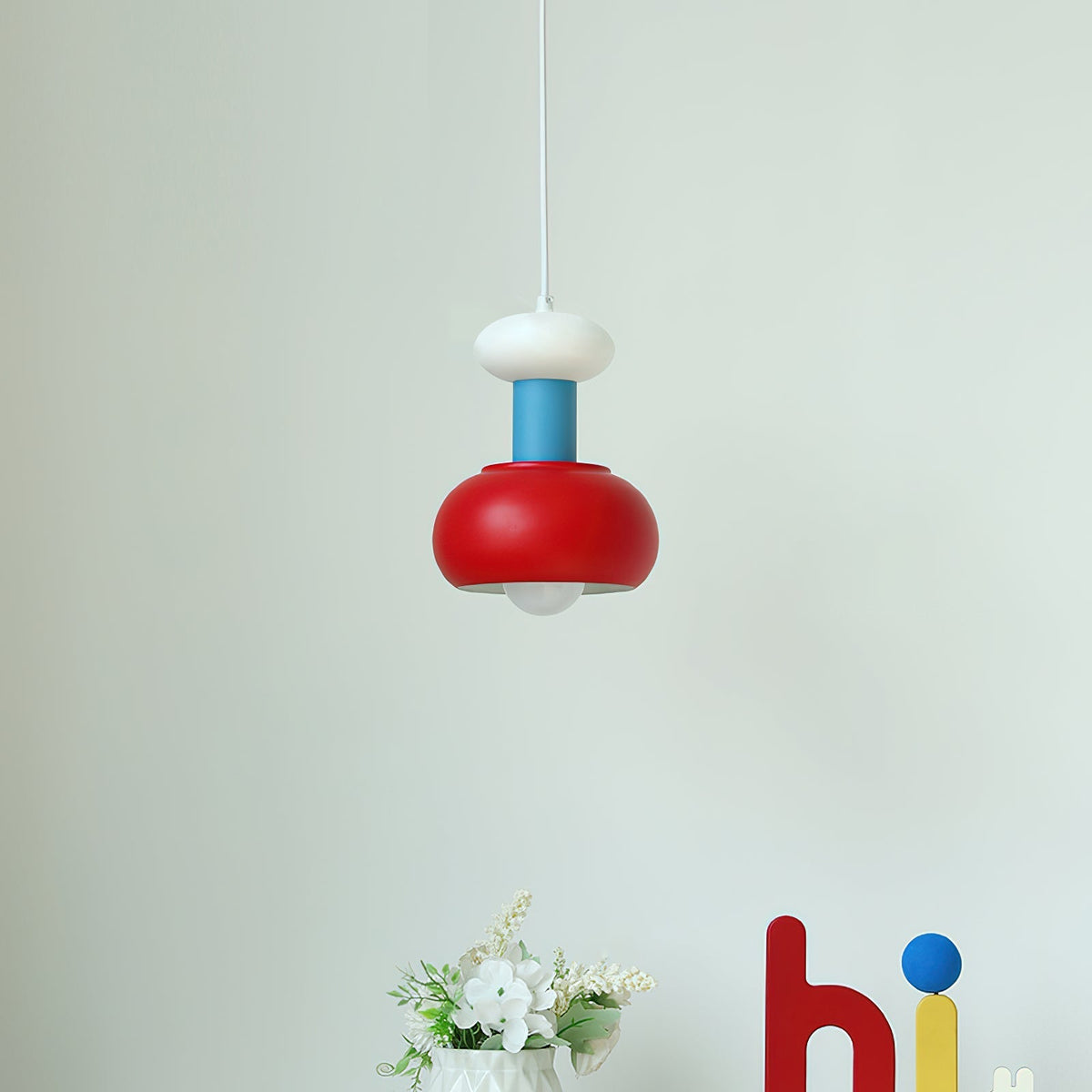 Meli Pendant Light shown in a creative workspace.