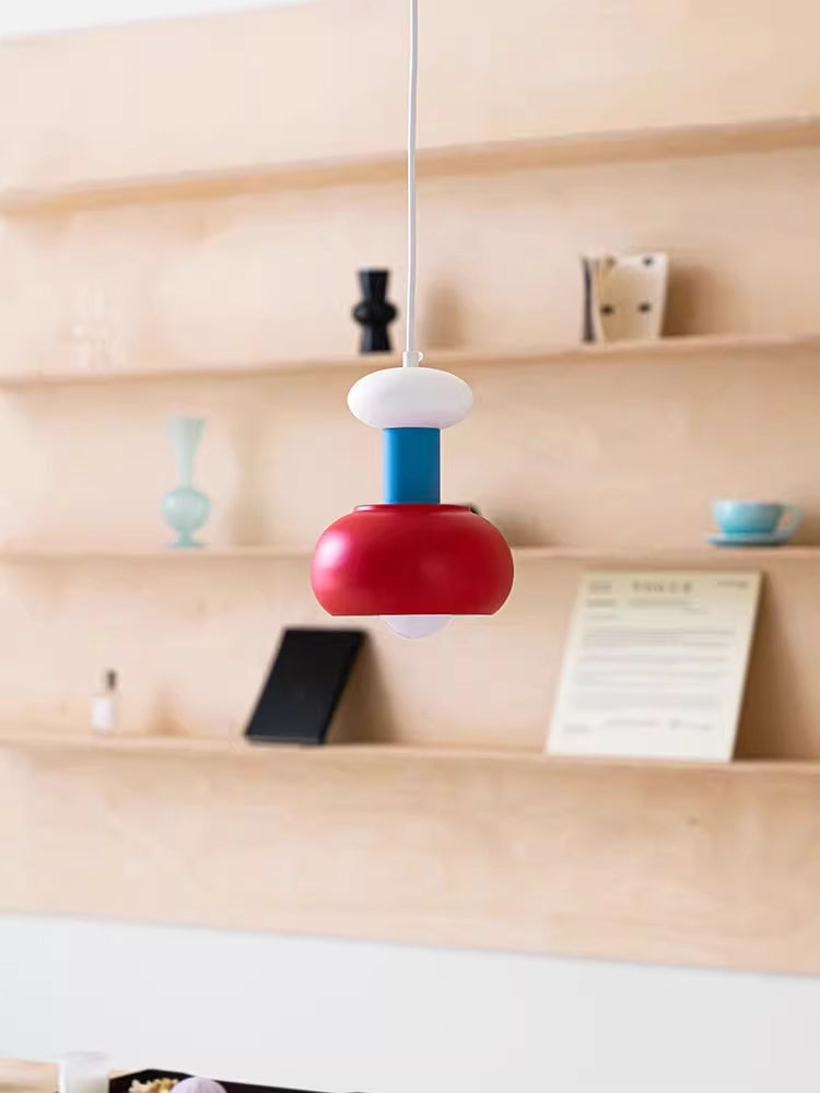 Meli Pendant Light illuminated, casting a warm glow.