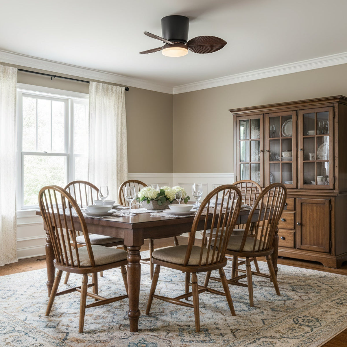 Melorie Ceiling Fan Light in white finish, installed in a bright living room.