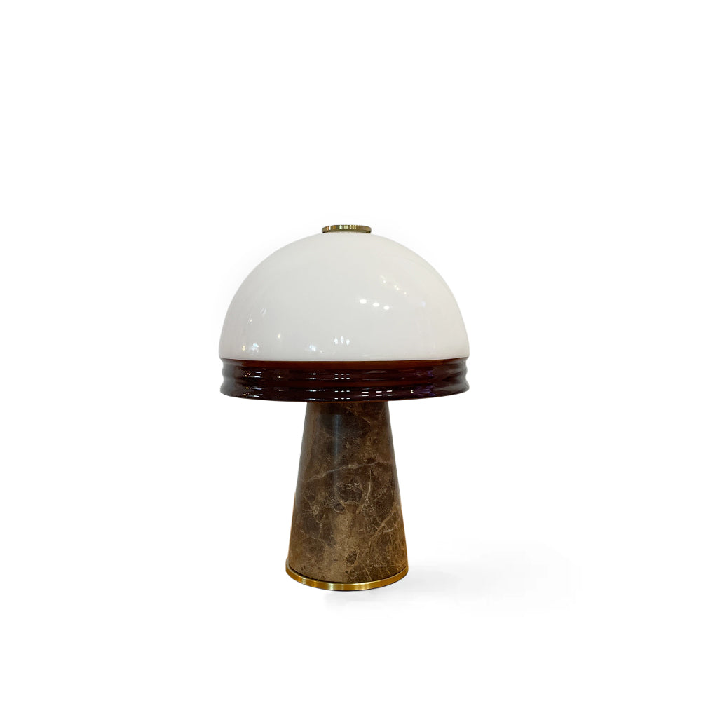 Milano Table Lamp with brown and white marble base and glowing opal glass orb.