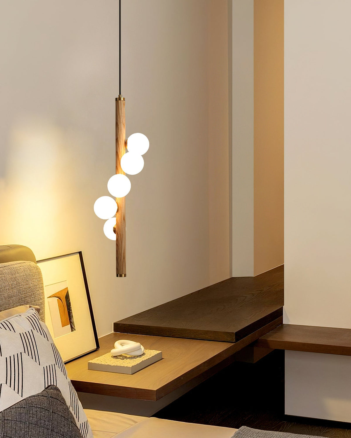 Close-up of the frosted glass globes and brass accents.
