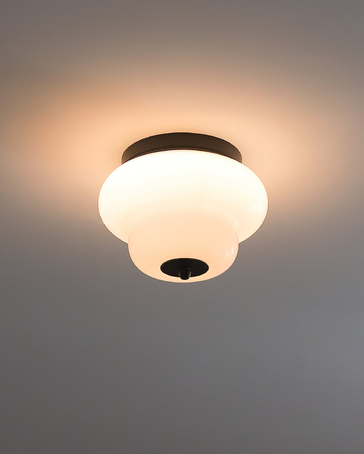 The Milo Ceiling Mount turned on, showing the warm, diffused light.