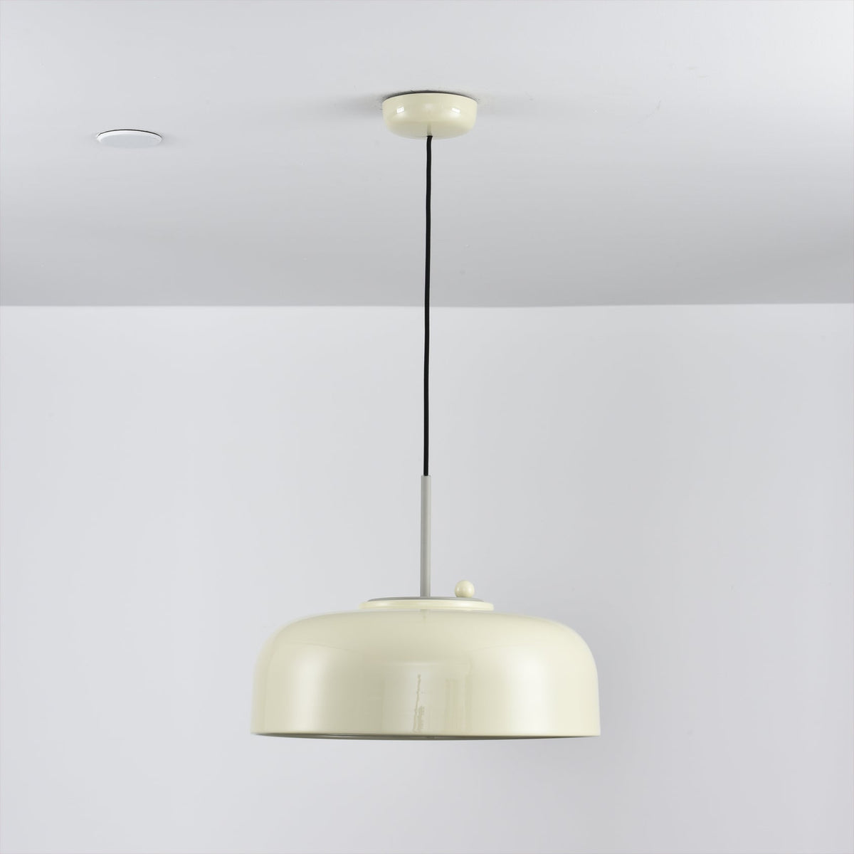Misha Pendant Light in mustard yellow, in a Scandinavian-style interior.