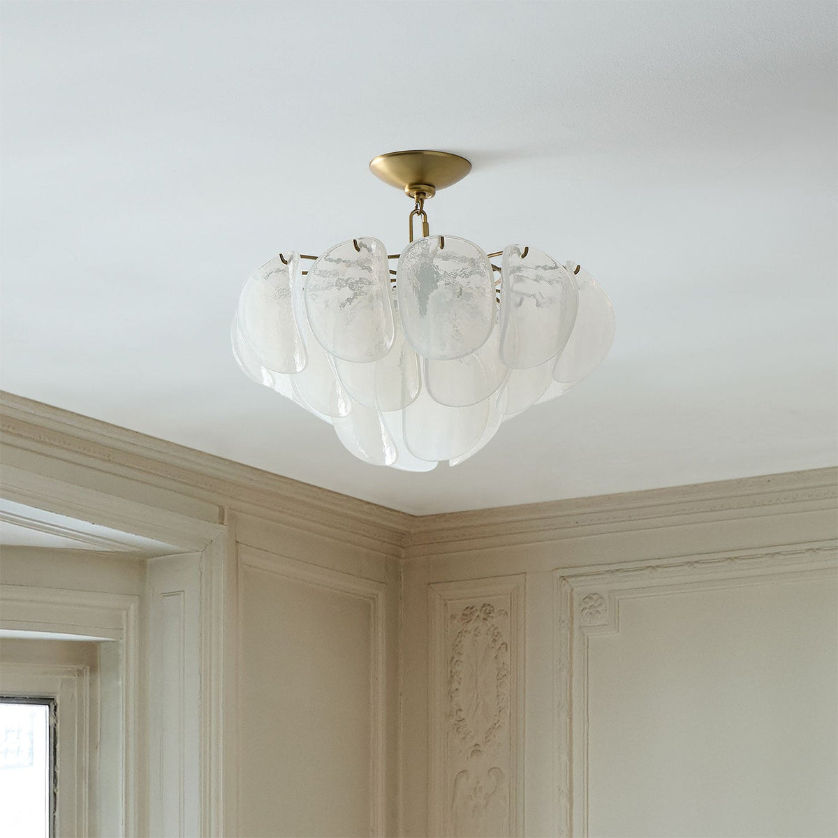 The Montecito ceiling light shown installed in a modern dining room setting.