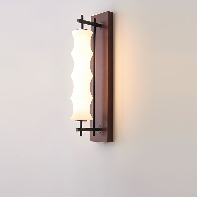 The Nesta wall sconce installed as a bedside reading light.