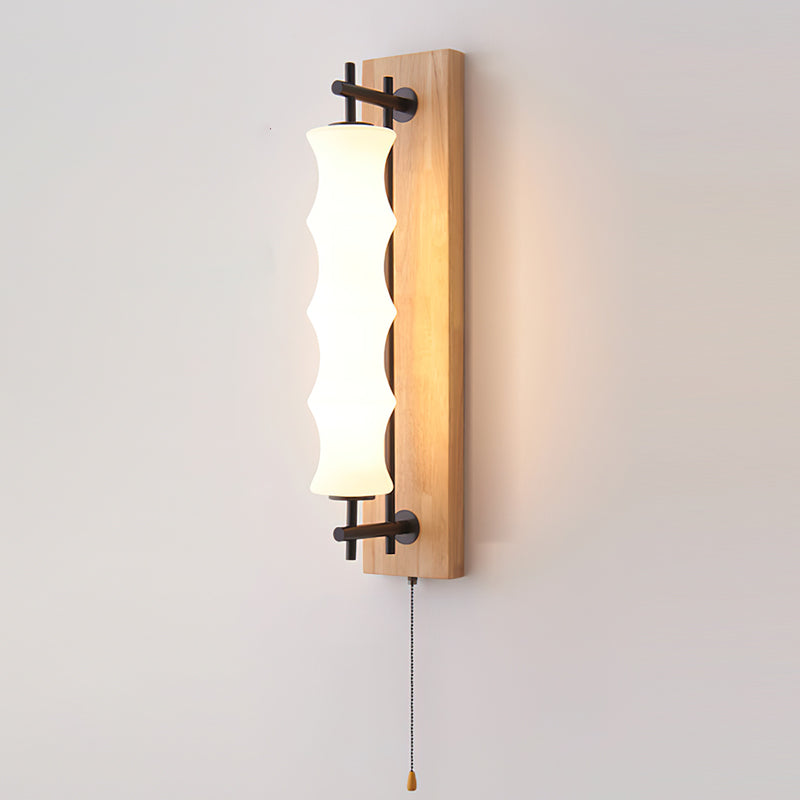 Front view of the Nesta wall sconce with the integrated LED illuminated.