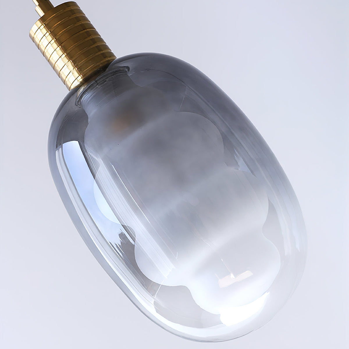 The smoky gray inner glass component of the Niche Pendant Light.