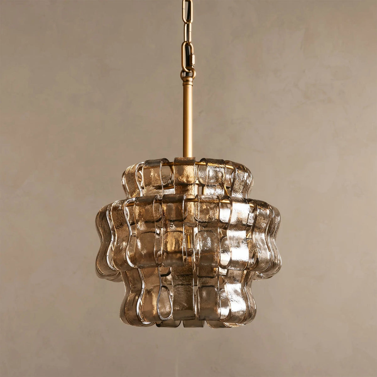 Nirsa Pendant Light in Amber, casting a warm, golden glow.