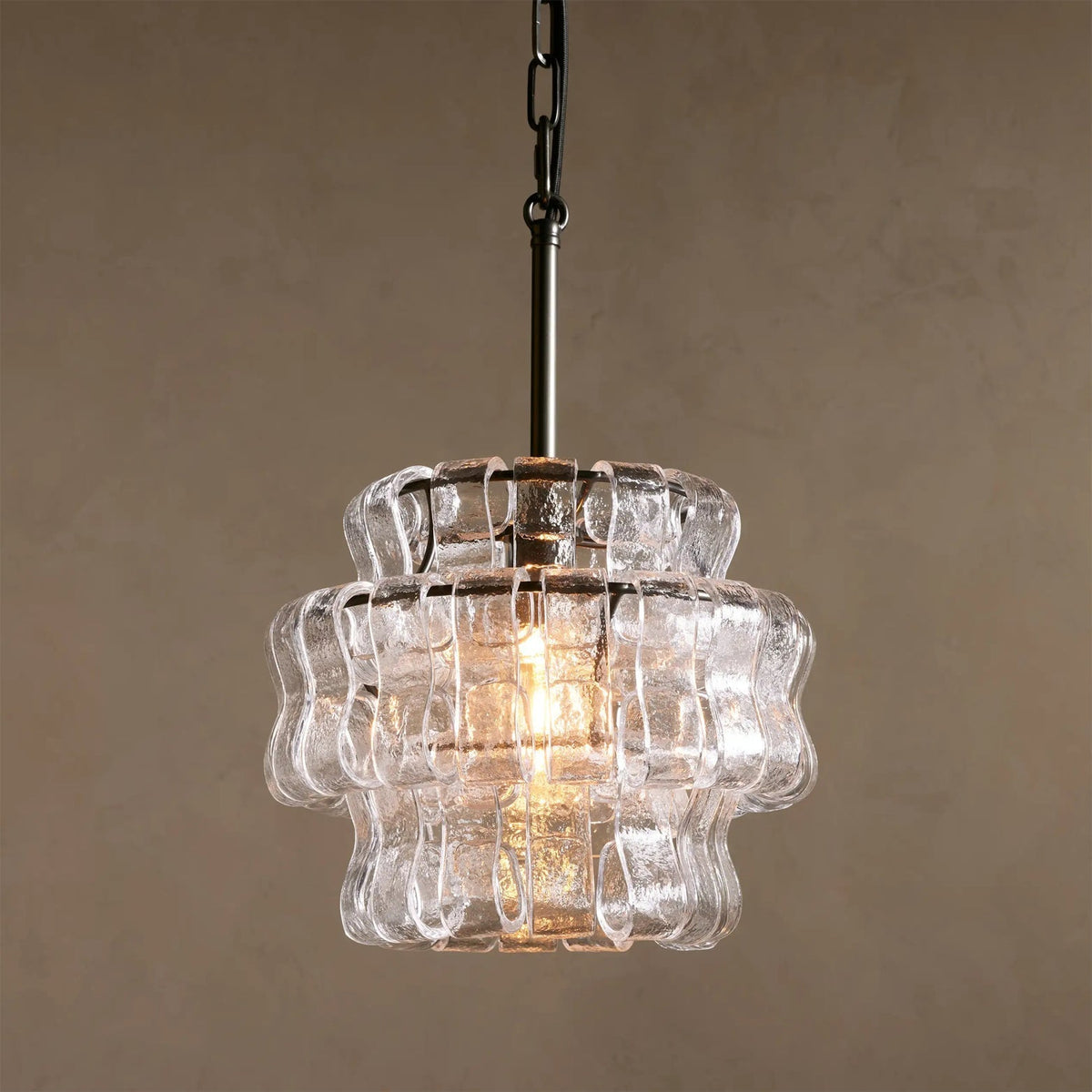 Close-up of the wave-like frozen texture on the glass panels of the Nirsa Pendant Light.