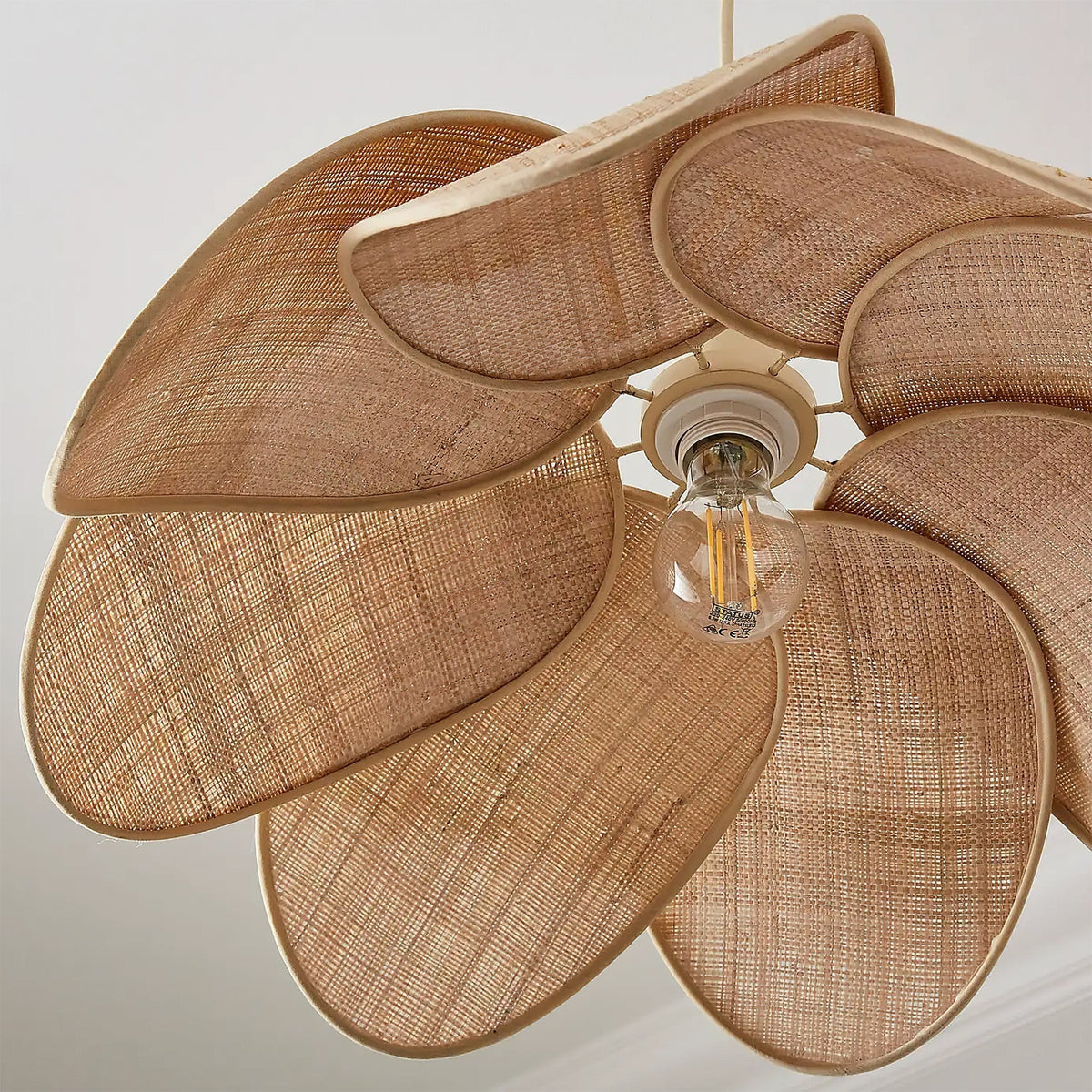 The natural texture and weave of the rattan material on the Odilia shade.
