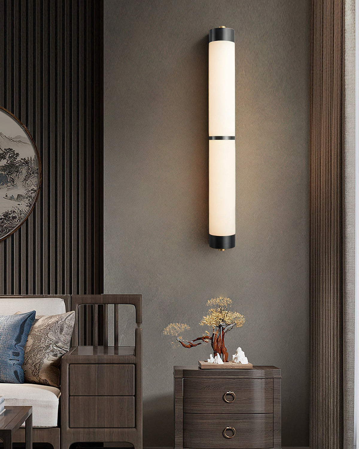 The Olmirira Alabaster Wall Light installed in a modern living room setting.