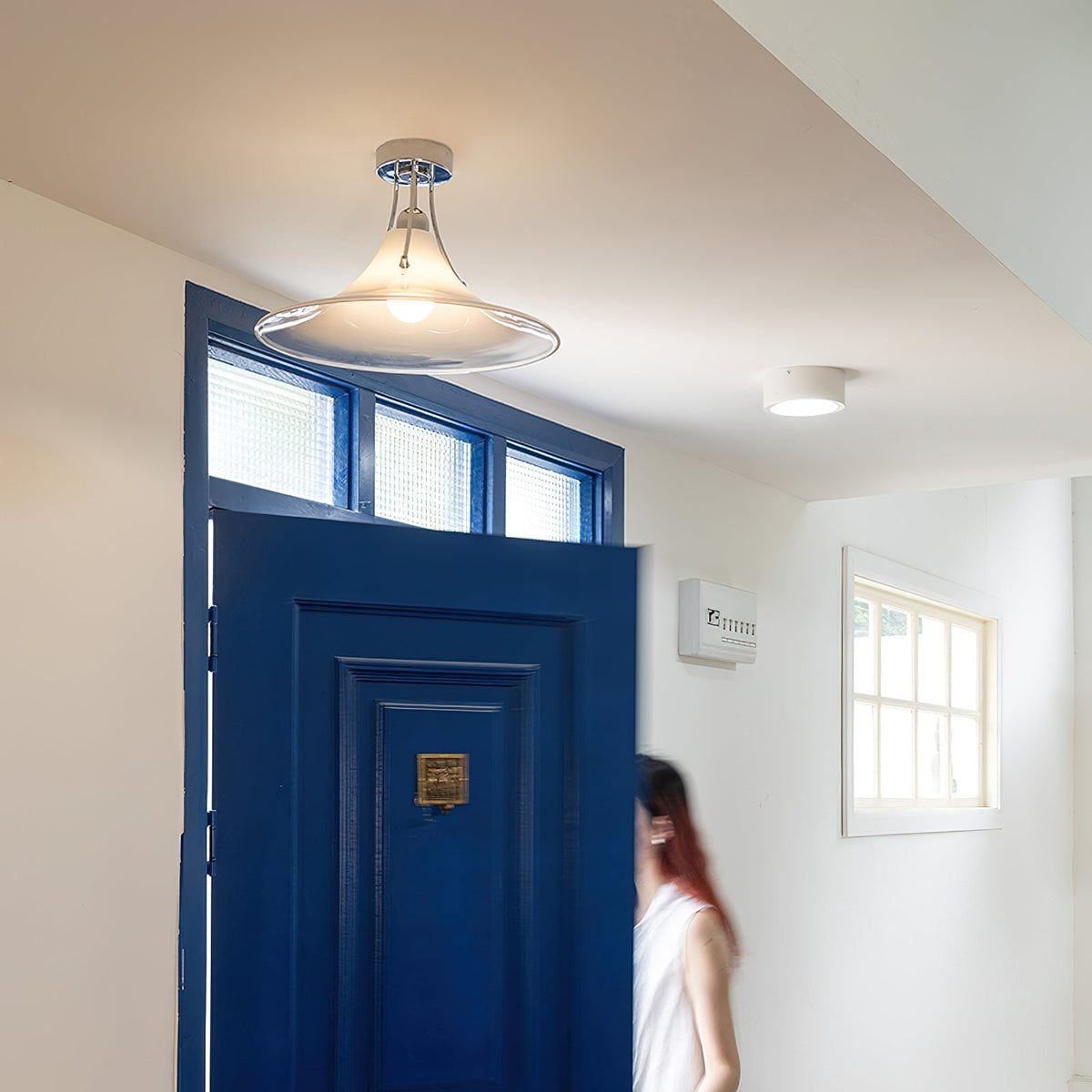 Orient Ceiling Lamp shown illuminated in a modern room setting.
