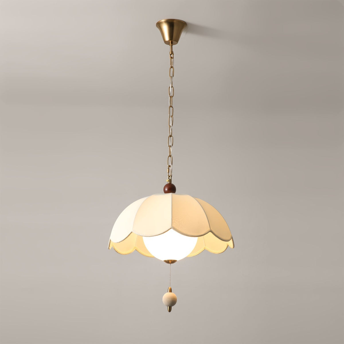 The Oriente Pendant Light illuminated, casting a warm glow.