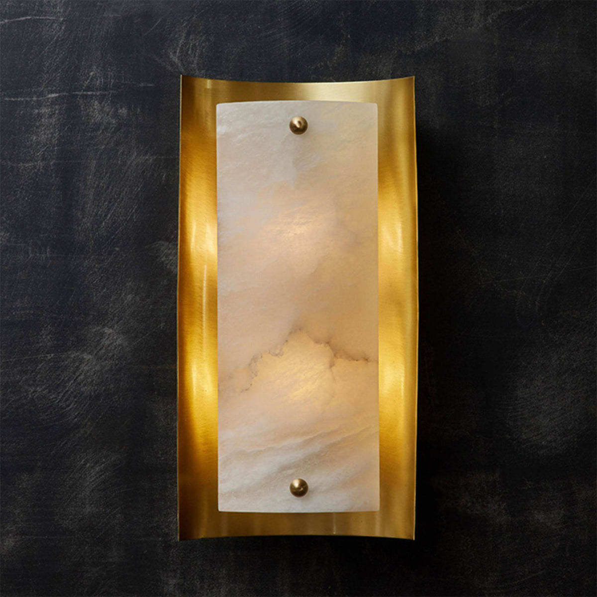 The wall lamp illuminated, casting a warm and inviting glow.