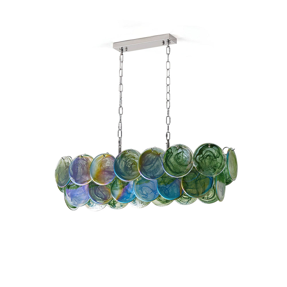 Pavone Linear Chandelier shown in a modern dining room setting.