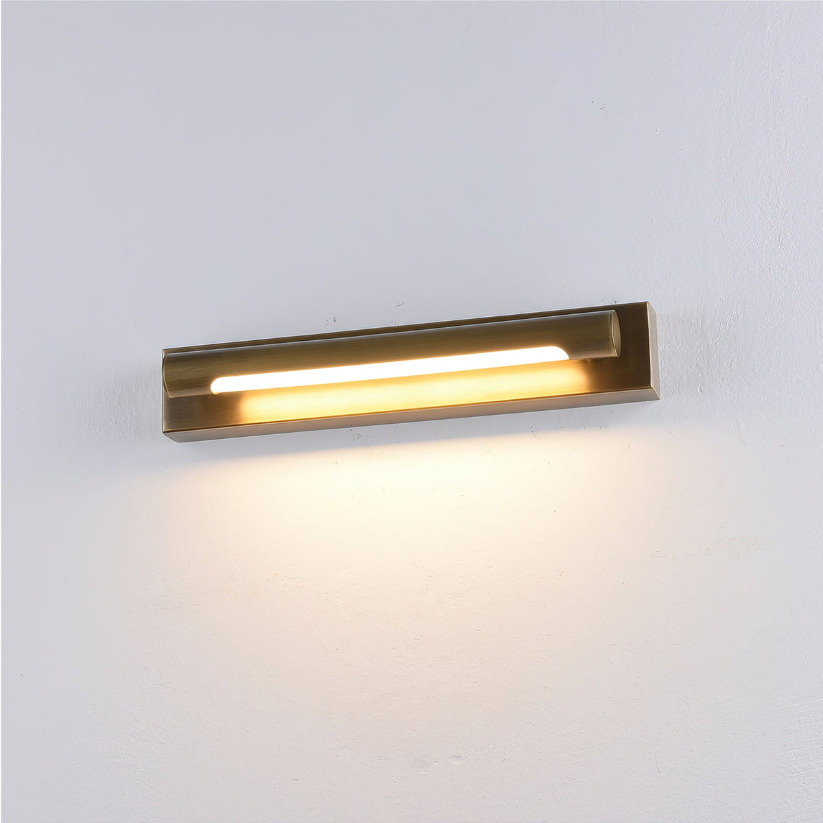 The Penrith Wall Sconce in black finish against a light-colored wall.