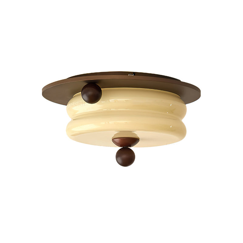 The Perth Ceiling Light in a dining room setting above a wooden table.