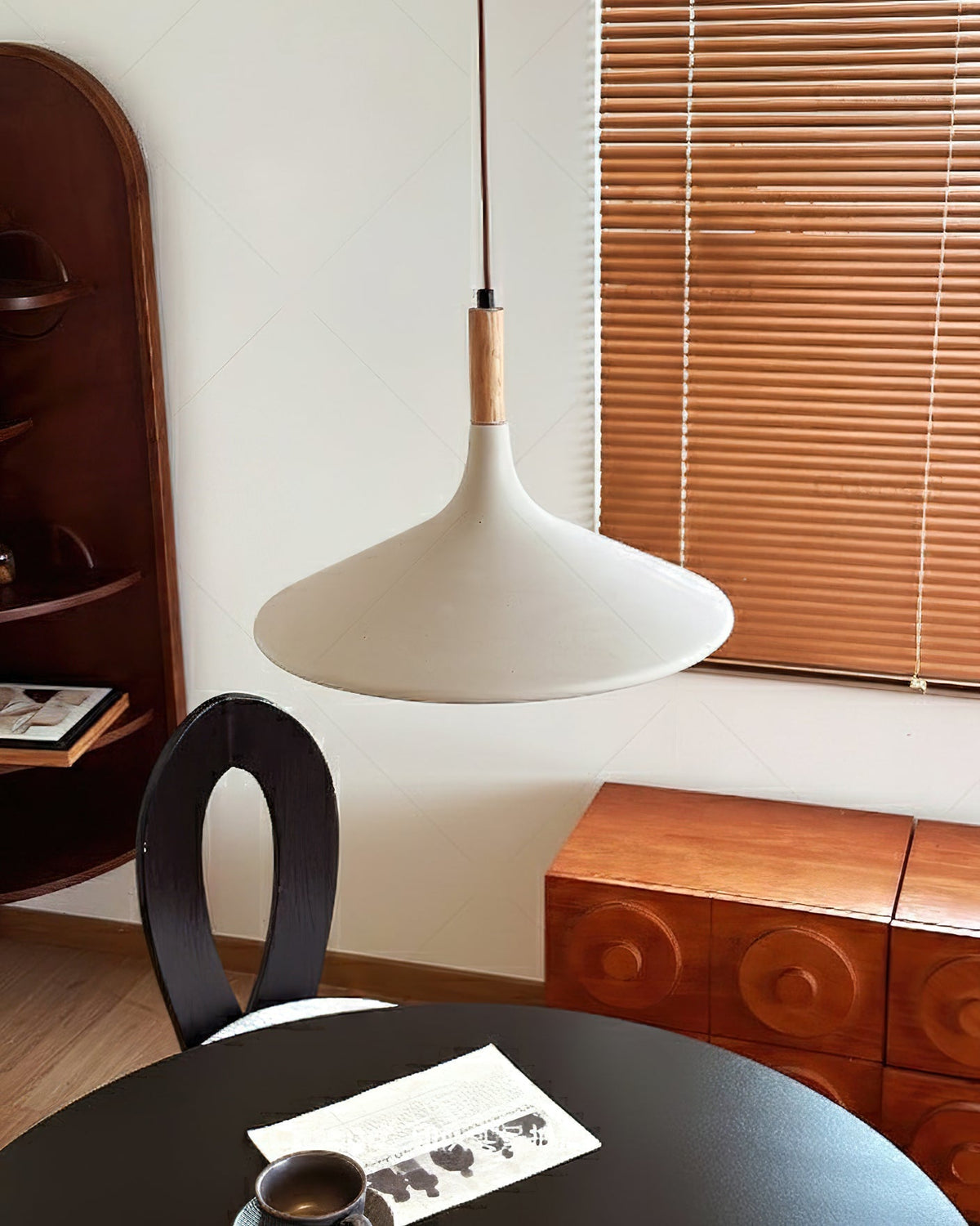 Piero Pendant Lamp hanging over a dining table.