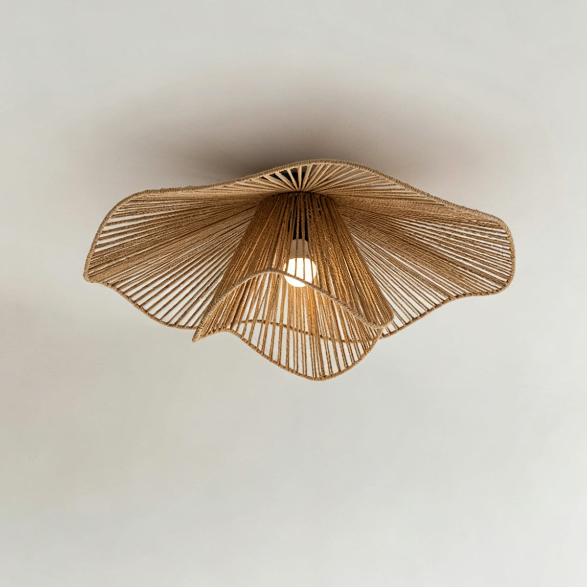 Close-up view of the hand-crafted rattan weave on the Pontos Ceiling Light.