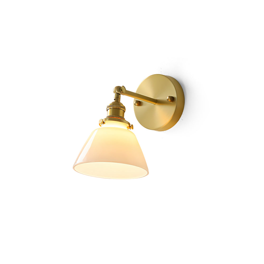 Portland Swivel Wall Sconce in brass with a white glass shade.