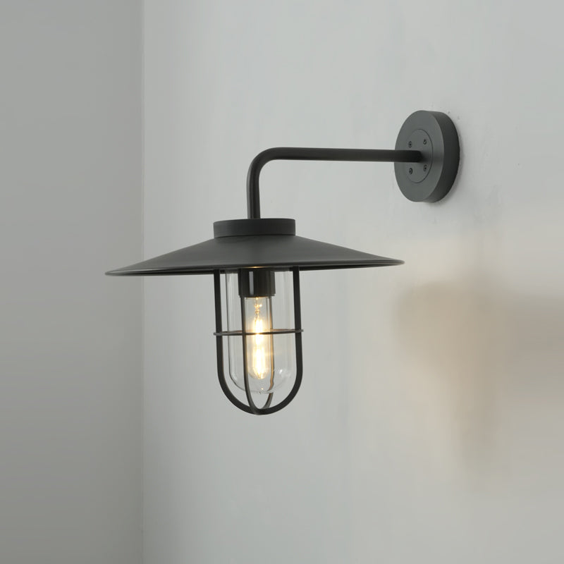 The Portree Wall Light displayed in a commercial space like a cafe.