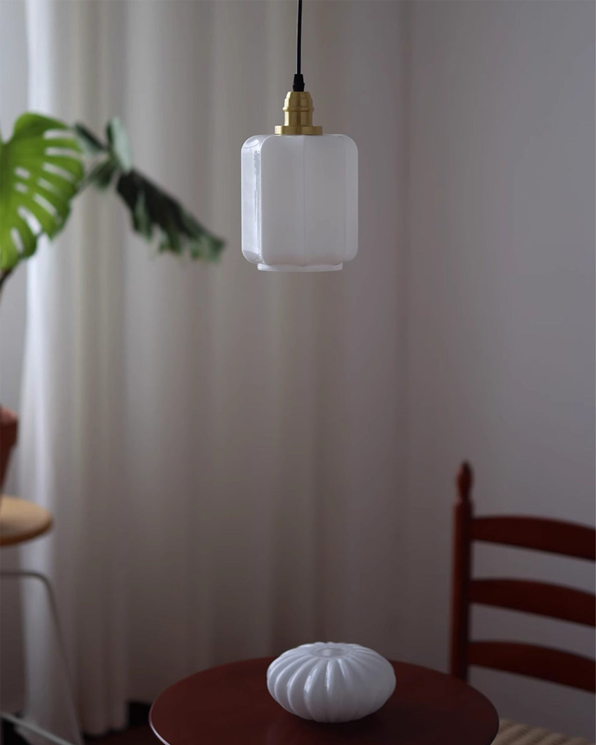 The Rayburn Pendant Light illuminating a dining area.