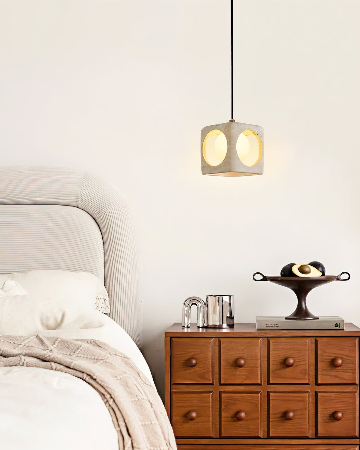 Detail shot of the metal and glass components of the pendant light.