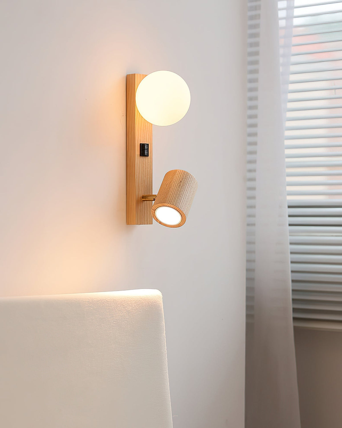 Rensen Wall Lamp shown mounted on a light-colored wall.