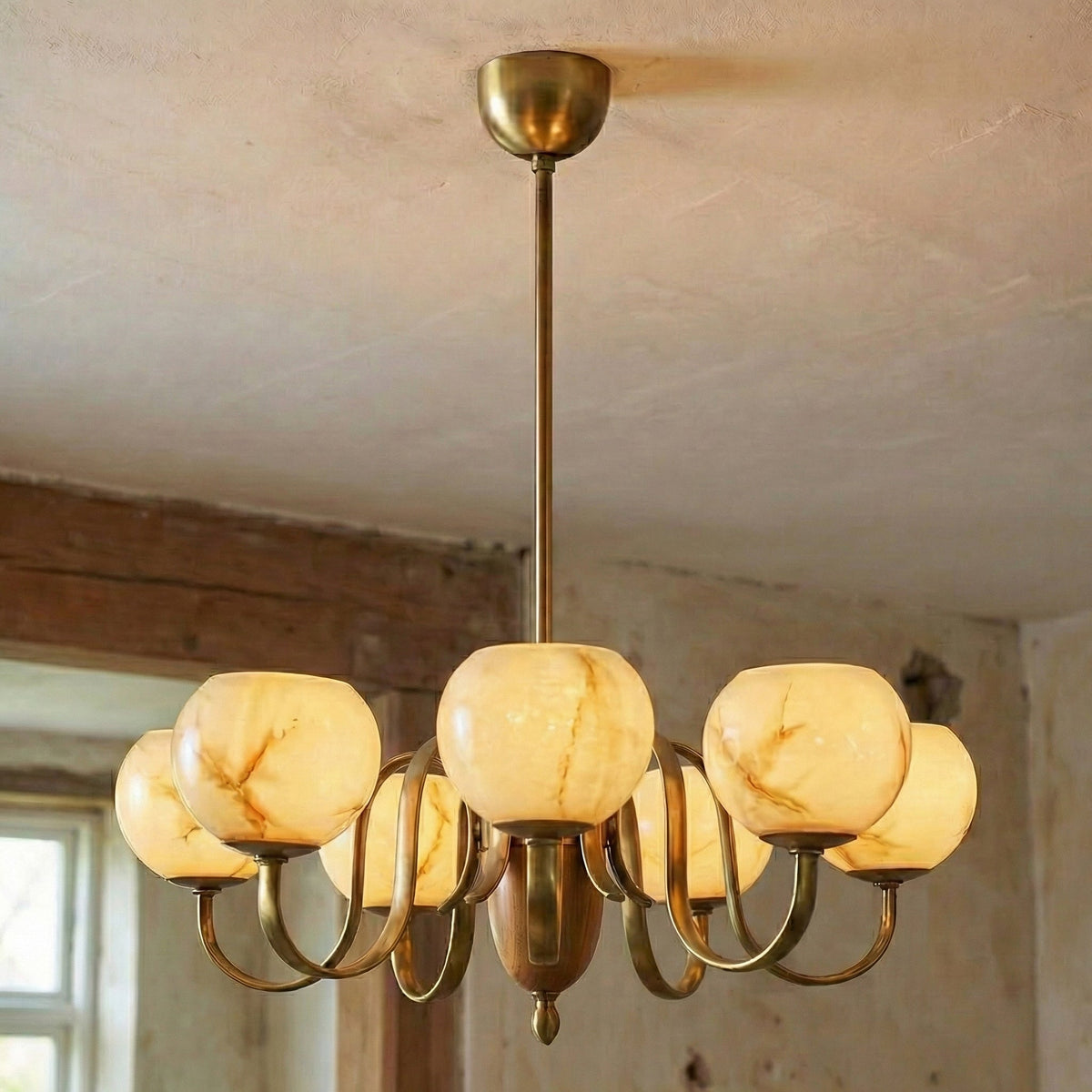 The Linnea Chandelier shown in a mid-century dining room setting.