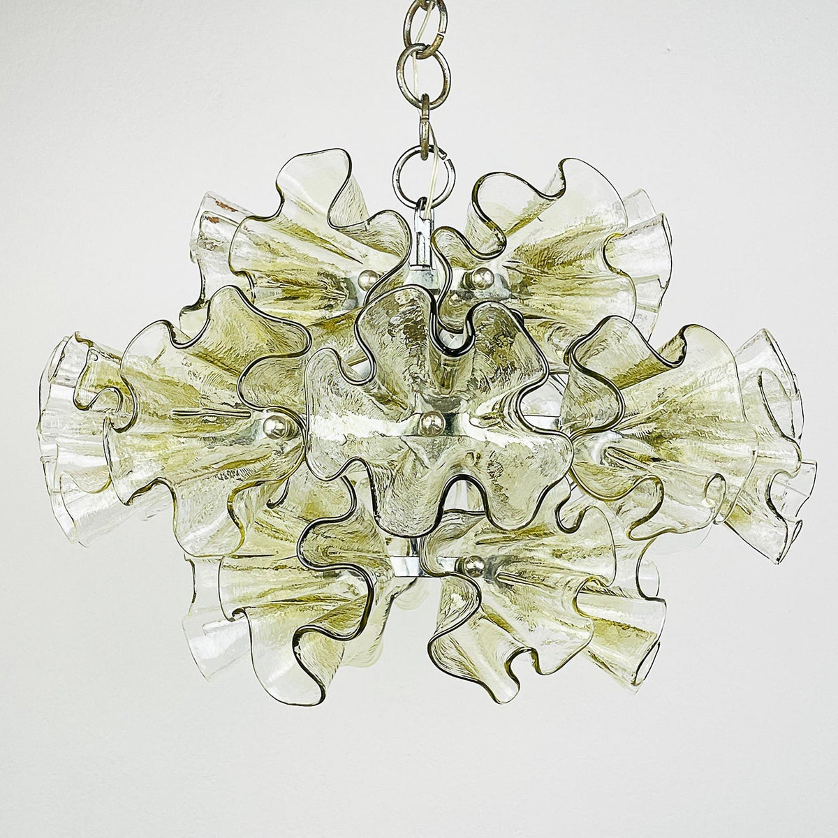 Close-up of the hand-blown green ruffled glass panels.