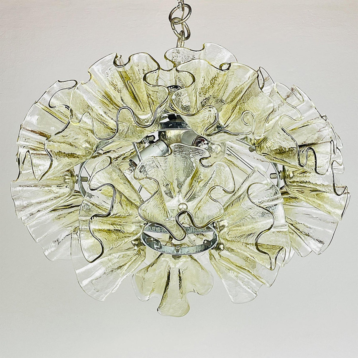 The orbital metal framework of the Ruffled Petal Chandelier.