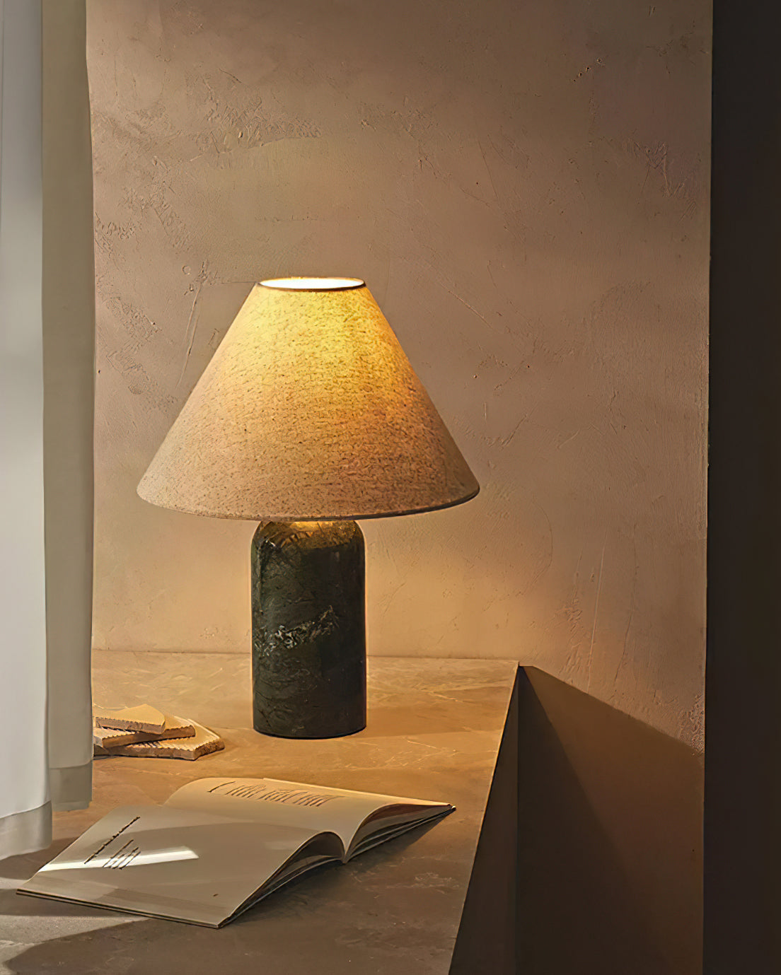 The Sacha Marble Table Lamp displayed in a black marble finish.