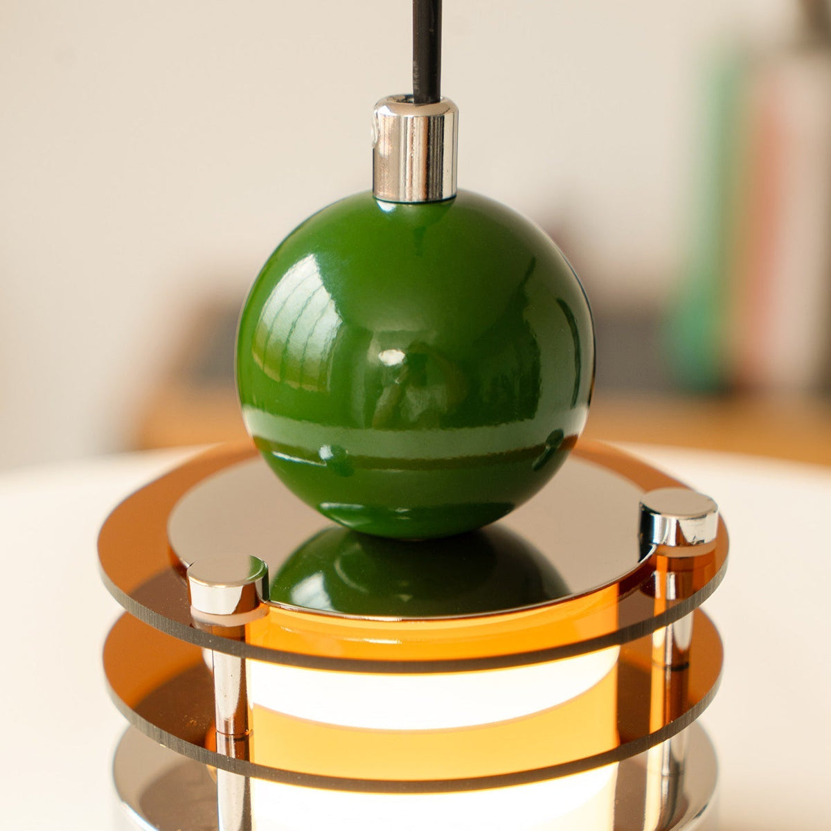 Lifestyle image of the Sia Scalloped Saucer Pendant in a contemporary home.