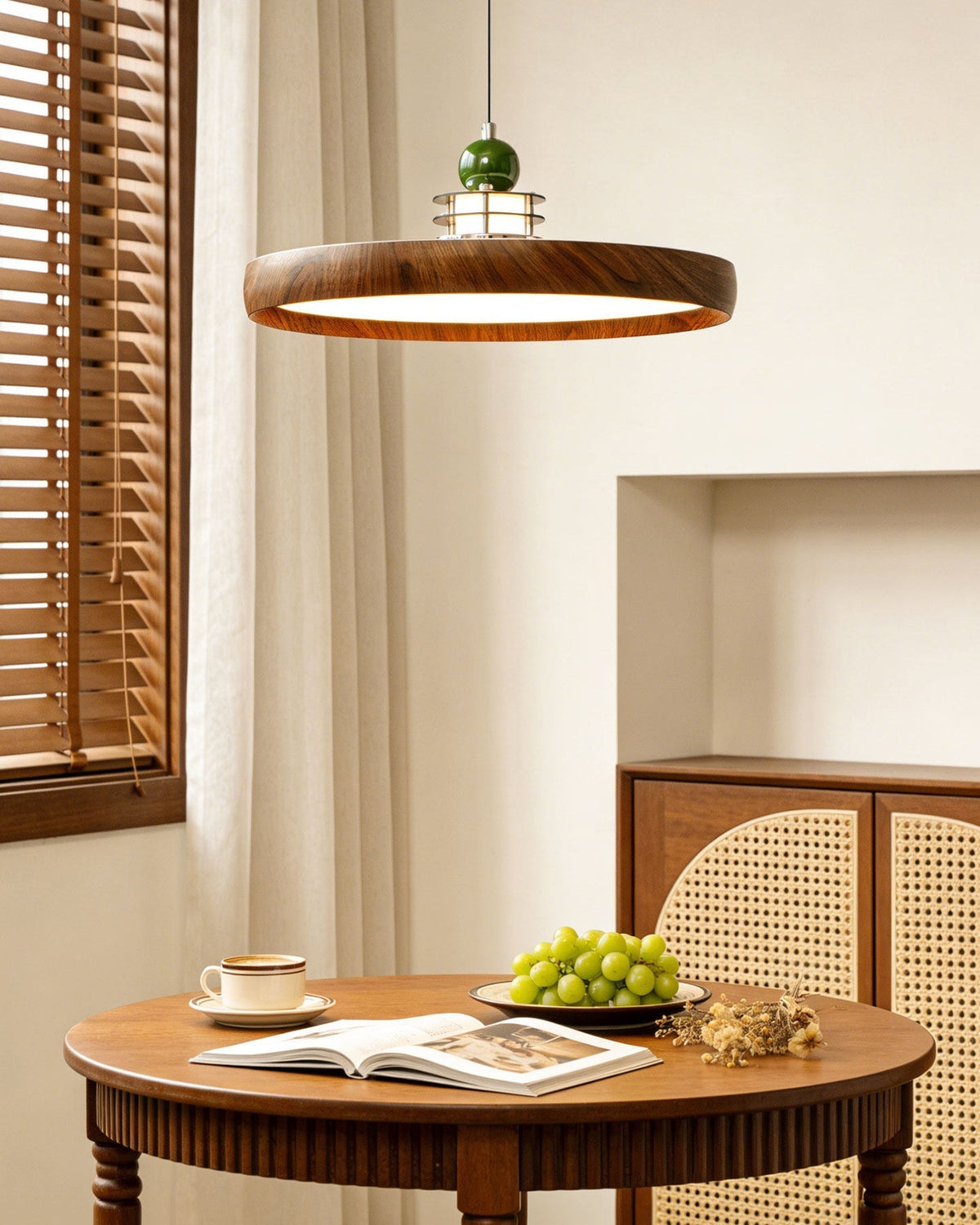 Angled view of the walnut finish Sia Pendant Light, highlighting its saucer shape.