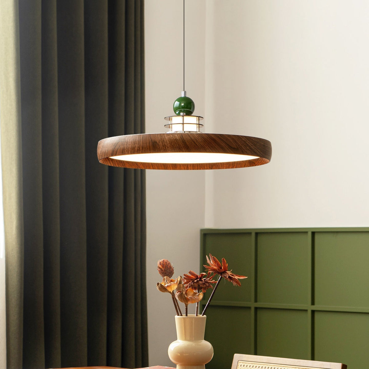 Close-up of the Sia Pendant Light's scalloped metal shade with a wood-grain finish.