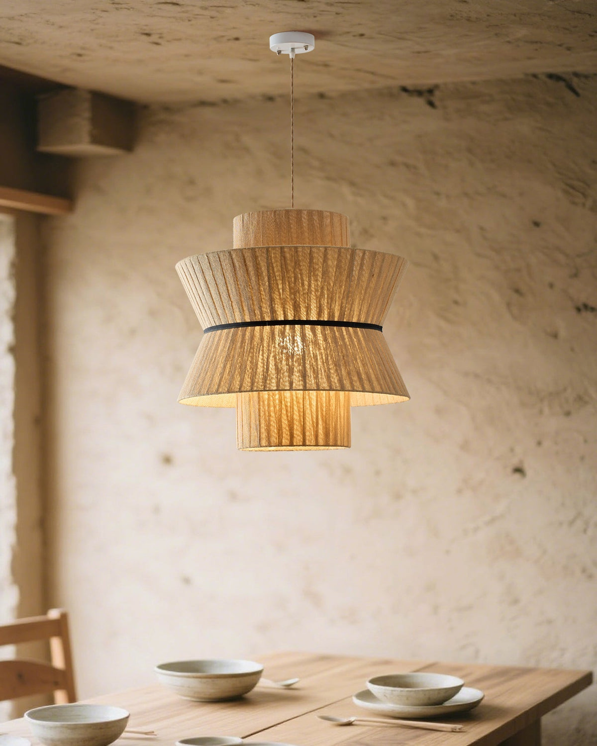 The medium size of the Sicel Pendant Light in a bedroom.