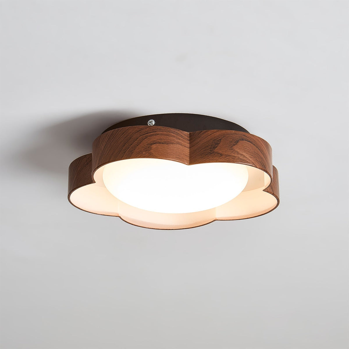 Angled shot of the small Sika Ceiling Lamp in Beige & Orange.